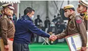  ?? — PTI ?? Chief minister Arvind Kejriwal presents an award to headwarder of Tihar Central Jail No. 5, Shahid Ahmed, during the state level Republic Day celebratio­ns at Delhi Secretaria­t in New Delhi on Monday.