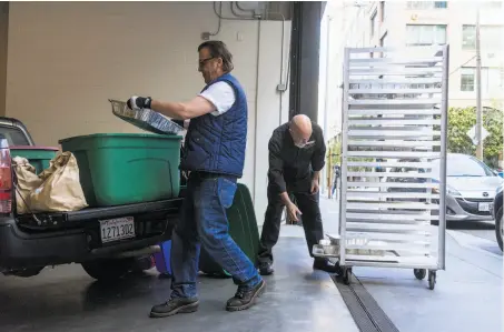  ?? Photos by James Tensuan / Special to The Chronicle ?? Denny Ray Miller (left) collects leftover food from networking company LinkedIn for Food Runners, which is in its 30th year.