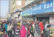  ?? HT FILE ?? People queue up outside a bank in New Delhi after the government scrapped old ₹500 and ₹1,000 notes last year.