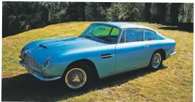  ??  ?? An Aston Martin DB6 was among the massive fire’s automotive victims.