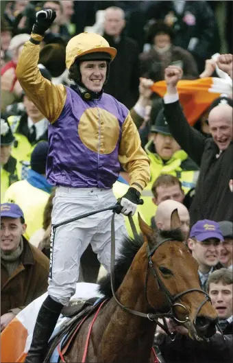  ??  ?? Tony McCoy celebrates after winning the Champion Hurdle on board the Colm Murphy-trained Brave Inca in 2006.
