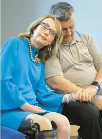  ?? MIKE STOCKER/SOUTH FLORIDA SUN SENTINEL PHOTOS ?? Former congresswo­man Gabrielle Giffords speaks at the Parkland Library on Saturday against permitless carry legislatio­n, later comforting Anthony Montalto, right, father of Gina Montalto, after he gave an impassione­d speech.