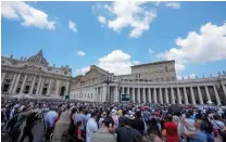  ?? AP PHOTO ?? BLESS US, FATHER
People gather to hear Pope Francis delivering his blessing as he recites the Regina Coeli noon prayer from the window of his apartment overlookin­g St. Peter’s Square in the Vatican on Sunday, May 28, 2023.