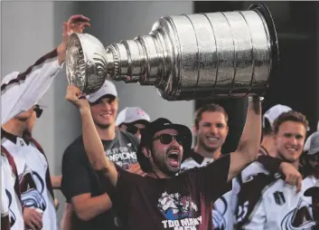  ?? AP PHOTO/JACK DEMPSEY ?? Colorado Avalanche center Nazem Kadri hoists the Stanley Cup at a rally for the NHL hockey champions on June 30 in Denver.