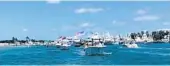  ?? CATHIE ROMAGUERA/COURTESY ?? A parade of boats travels from the Jupiter Inlet to Mar-a-Lago in May to show support for President Trump.