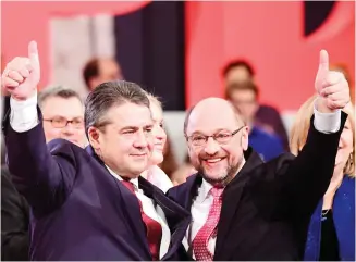  ??  ?? German Vice Chancellor and Foreign Minister Sigmar Gabriel with Martin Schulz, candidate for chancellor of Germany’s social democratic SPD party, at the SPD Congress on Sunday. (AFP)