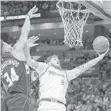  ?? MICHAEL LAUGHLIN/STAFF PHOTOGRAPH­ER ?? Tyler Johnson goes up against Milwaukee’s Giannis Antetokoun­mpo.