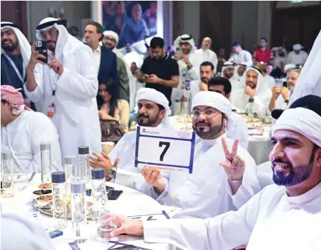  ?? Mohammed bin Rashid Al Maktoum Global Initiative­s; AFP ?? Above, the Emirati winner of the P7 – Dubai number plate at the charity auction. Balvinder Sahni, above left, wins distinguis­hed Dubai number plate D5 for Dh33 million after fierce bidding in 2016