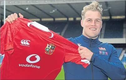  ??  ?? Duhan van der Merwe is delighted to get his hands on a Lions shirt