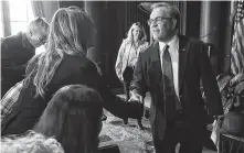  ?? Mark Wilson / Getty Images ?? Acting EPA Administra­tor Andrew Wheeler greets employees on Wednesday at the EPA’s headquarte­rs.