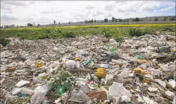  ?? John Gibbins San Diego Union-Tribune ?? POLLUTION in the Tijuana River. San Diego County officials have demanded that infrastruc­ture along the border be beefed up to ensure that f lows from Mexico are captured before they foul wetlands and beaches.