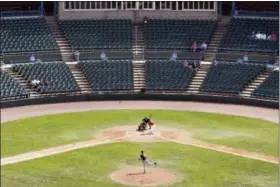  ?? MATT ROURKE — THE ASSOCIATED PRESS ?? In this Thursday photo, Stockton University and Rutgers University–Camden baseball teams play a game at Campbell’s Field in Camden, N.J. The baseball stadium that was hailed as a sign of the bright future of the waterfront in the poverty-stricken city...