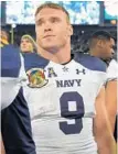  ?? KARL MERTON FERRON/BALTIMORE SUN ?? Navy quarterbac­k Zach Abey shows his disappoint­ment after the loss. He started the game in place of the injured Will Worth.