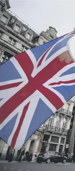  ?? ?? 0 Anti-brexit protesters wave the flags of the United Kingdom, Ireland and European Union outside Parliament yesterday