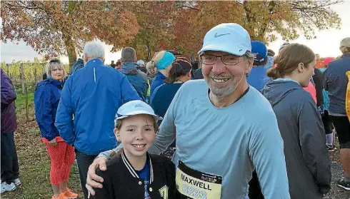  ?? PHOTOS: PAUL MAXWELL ?? Paul Maxwell and his granddaugh­ter complete the 10km run together at the Hawke’s Bay Marathon.