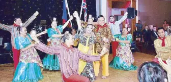  ??  ?? The Lahing Kayumanggi Dance Company is composed of Pinoys based in the United Kingdom and headed by Ronnie del Barrio (right).