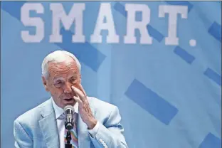  ?? AP - Gerry Broome ?? North Carolina coach Roy Williams pauses to compose himself as he speaks during Thursday’s news conference in which he spoke about his retirement.