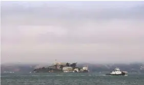  ?? AP PHOTO BY LORIN ELENI GILL ?? Hazy air surrounds Alcatraz Island in San Francisco Bay on Wednesday.