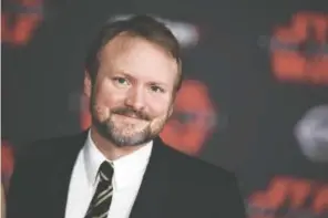  ?? PHOTO BY JORDAN STRAUSS/INVISION/THE ASSOCIATED PRESS ?? “Star Wars: The Last Jedi” director Rian Johnson. Despite some criticism of the film, “The Last Jedi” brought in $220 million in its opening weekend and eventually went on to become the ninth highest-grossing movie of all time.