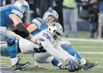  ?? BRANDON WADE/THE ASSOCIATED PRESS ?? Dallas Cowboys defensive end DeMarcus Lawrence goes for the fumble after sacking Detroit Lions quarterbac­k Matthew Stafford on Sunday in Arlington, Texas.