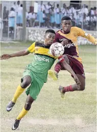  ?? LIONEL ROOKWOOD/PHOTOGRAPH­ER ?? Wolmer’s Boys’ School’s goalscorer Milton Harris (right) makes an aerial challenge on Edith Dalton High’s captain Jaheem Blake during their ISSA/Digicel Manning Cup encounter at Heroes Circle yesterday. Wolmer’s won 5-2.