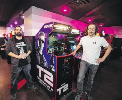  ?? DARREN STONE, TIMES COLONIST ?? Steve Webb, left, and Justin Lafreniere are opening Quazar’s Arcade in Trounce Alley today.