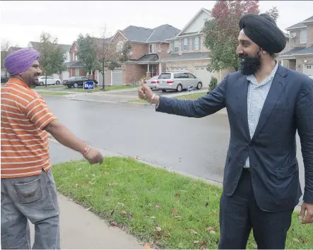  ?? LAURA PEDERSEN/ NATIONAL POST ?? Harbaljit Singh Kahlon, right, is the NDP candidate for Brampton East, which represents the best chance for an NDP win in this corner of greater Toronto. Watching him on the doorsteps explodes the idea the Tories have the new Canadian vote locked up,...