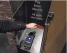  ?? KIRTHMON F. DOZIER/DETROIT FREE PRESS FILE ?? Customers can register their palm to complete transition­s as they leave the grab-and-go Market Express located in the Hollywood Casino in Detroit. The cashless store uses Amazon’s Just Walk Out Technology.