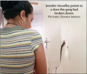  ?? PICTURES: SIYANDAMAY­EZA ?? Jennifer Moodley points to a door the gang had
broken down.