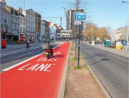  ?? PHOTO: PAUL GILLIS ?? New bright red lane markings like this one in the city centre have appeared in Bristol, designatin­g new bus gates and bus lanes