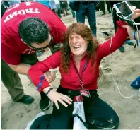  ?? AP ?? Jennifer Sterling, one of the organisers of the pro-Donald Trump rally, reacts after getting hit with pepper spray on Saturday. —