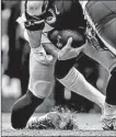  ?? ALEX BRANDON/AP ?? Redskins quarterbac­k Alex Smith’s right fibula and tibia are broken on a sack during a loss to the Texans.