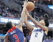  ?? ALEX BRANDON/ASSOCIATED PRESS ?? Washington Wizards guard Bradley Beal, left, attempts to block a shot by Magic guard Elfrid Payton in the first half.