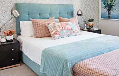  ??  ?? 2.
In this bedroom, scatter cushions in a small geometric pattern provide a contrast to the aqua headboard, while the smaller Chinese design scatter pulls all the colours in the scheme together.