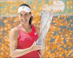  ?? Picture: GEOFF BURKE – USA TODAY ?? STAR RISING: Great Britain’s Johanna Konta holds the Butch Buchholz Trophy after her match against Caroline Wozniacki, of Denmark, in the women’s singles championsh­ip of the 2017 Miami Open