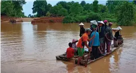  ?? (Reuters) ?? VILLAGERS ARE evacuated Tuesday after the Xepian-Xe Nam Noy hydropower dam collapsed in Attapeu.