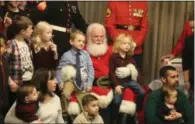  ?? LAUREN HALLIGAN ?? A crowd of event-goers gather around Santa Claus at the 2018 Breakfast with Santa event at the Hilton Garden Inn in Saratoga Springs.