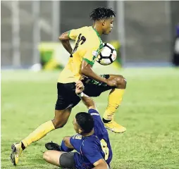  ?? FILE ?? Peter-Lee Vassell in action against Cayman Islands during their Nations League clash at the National Stadium in September.