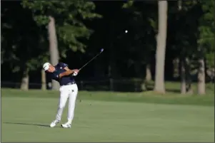  ?? The Associated Press ?? TAKING A BIG LEAD: Collin Morikawa hits on the 13th hole during the second round of the Workday Charity Open Friday in Dublin, Ohio.