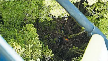  ?? Photo / Supplied by Police ?? View from the RNZAF NH90 helicopter of Jessica O’Connor and Dion Reynolds in the Kahurangi National Park after being lost for nearly three weeks.