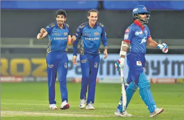  ?? BCCI ?? Jasprit Bumrah (L) of Mumbai Indians celebrates the wicket of Shikhar Dhawan of Delhi Capitals during IPL Qualifier 1 on Thursday.