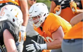  ?? TENNESSEE ATHLETICS PHOTO ?? Former Bradley Central offensive tackle Austin Sanders goes through a workout at Tennessee in 2016. Sanders suffered a torn biceps during his time in Knoxville but did play 16 career games for the Volunteers.