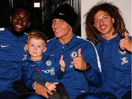  ??  ?? Visit: Bakayoko, Luiz and Ampadu (right) with young Hudson