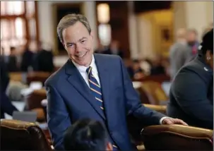  ?? The Associated Press ?? SPEAKER OF THE HOUSE: Texas Speaker of the House Joe Straus, R-San Antonio, talks with fellow lawmakers April 19 on the House floor at the Texas Capitol in Austin. Straus has for months opposed a “bathroom bill” targeting transgende­r people, saying the...