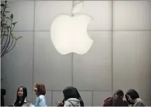  ?? THE ASSOCIATED PRESS FILES ?? Much of Apple Inc.’s cash held overseas is likely to flow back to investors after the tech giant pledged this week to contribute US$350 billion to the U.S. economy over the next five years.