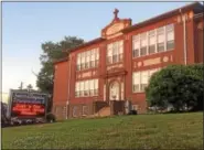  ?? EVAN BRANDT — DIGITAL FIRST MEDIA ?? The cornerston­e of the St. Aloysius Parish School building on North Hanover Street was laid in 1913. The school will bemoving into the former St. Pius X High School on North Keim Street at the start of the 2017-18school year.