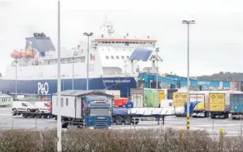  ?? — AFP ?? A P&0 ferry arrives at the Port of Larne in County Antrim, Northern Ireland, on Tuesday. The British government condemned threats to port workers implementi­ng post-brexit trade checks in Northern Ireland and called for clear heads to ease tensions.