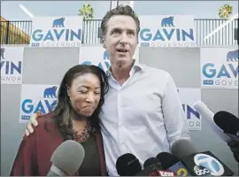  ?? Carolyn Cole Los Angeles Times ?? LT. GOV. Gavin Newsom gives a hug to Va Lecia Adams Kellum, president of the St. Joseph Center in Venice. Newsom dominates among L.A. and Bay Area voters.