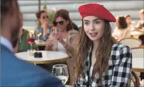  ?? Associated Press ?? Lily Collins in a scene from the series “Emily in Paris,” streaming on Netflix.