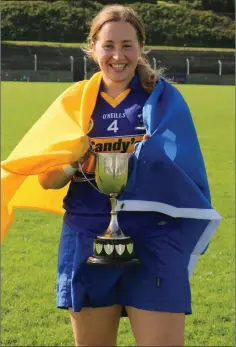  ??  ?? Carnew Emmets captain Aoife Darcy with the Junior cup.